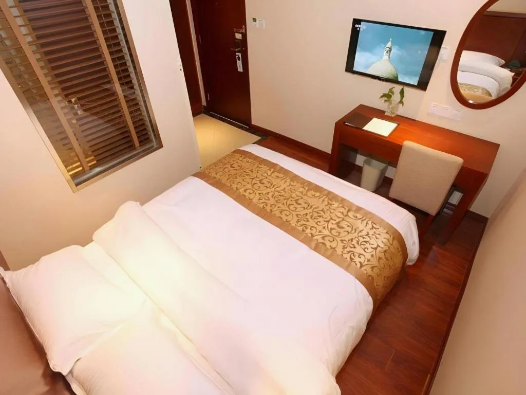 Bed in GreenTree Inn Shanghai Songjiang WanDa Plaza RonGMEi Road Express Hotel