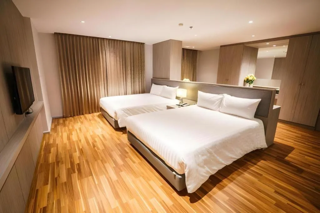Bed in New Season Square Hotel