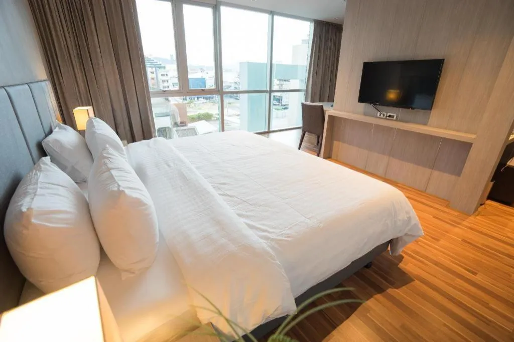 Bed in New Season Square Hotel