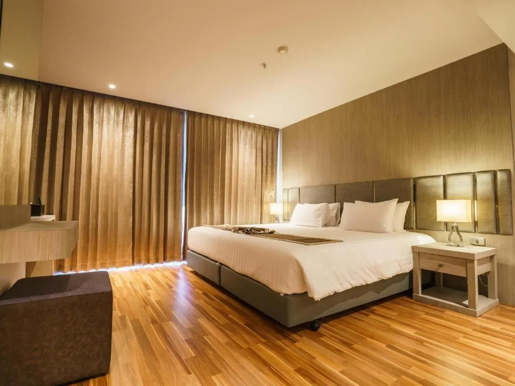 Bed in New Season Square Hotel