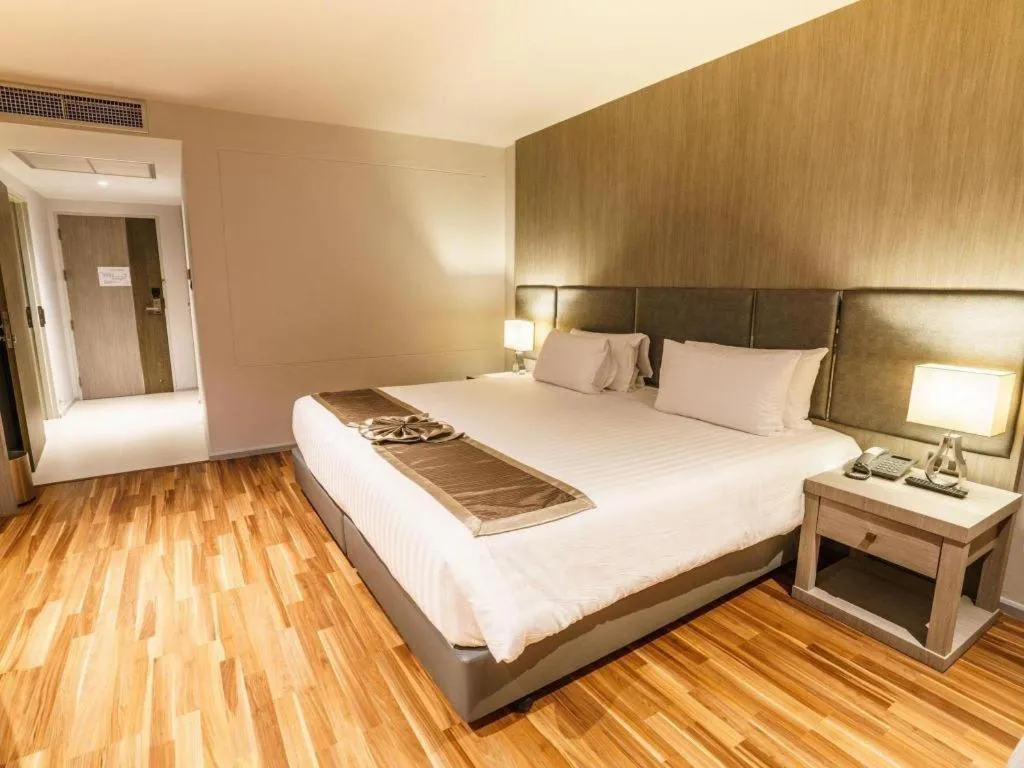 Bed in New Season Square Hotel