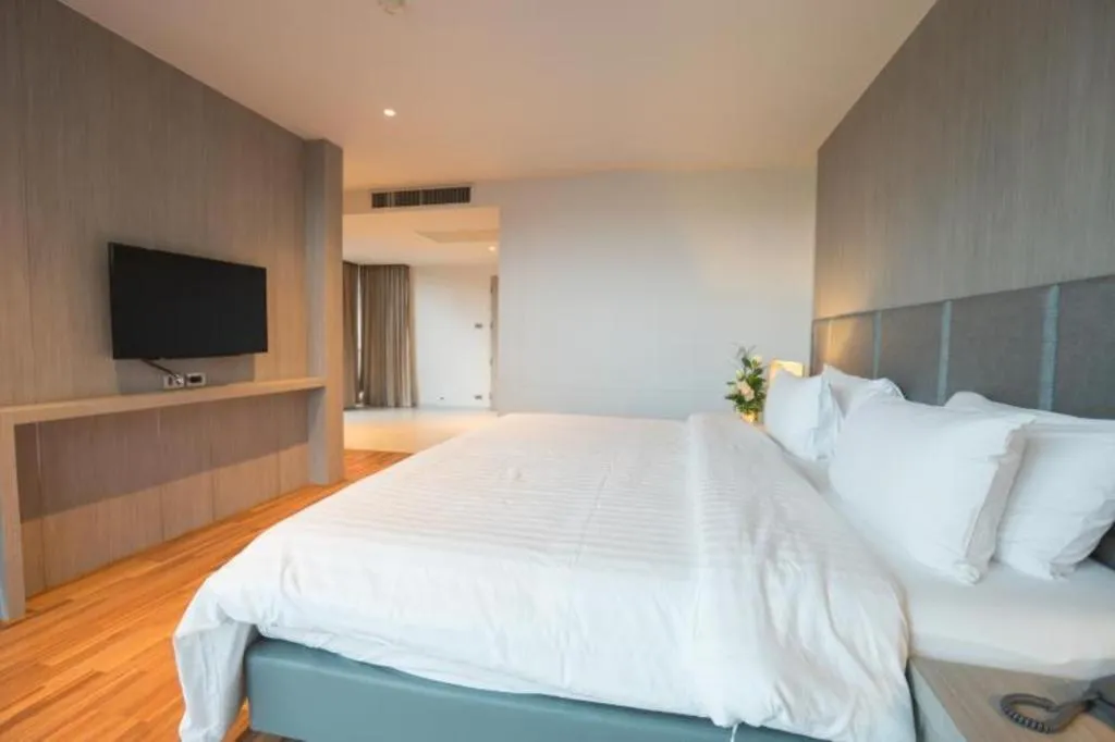 Bed in New Season Square Hotel