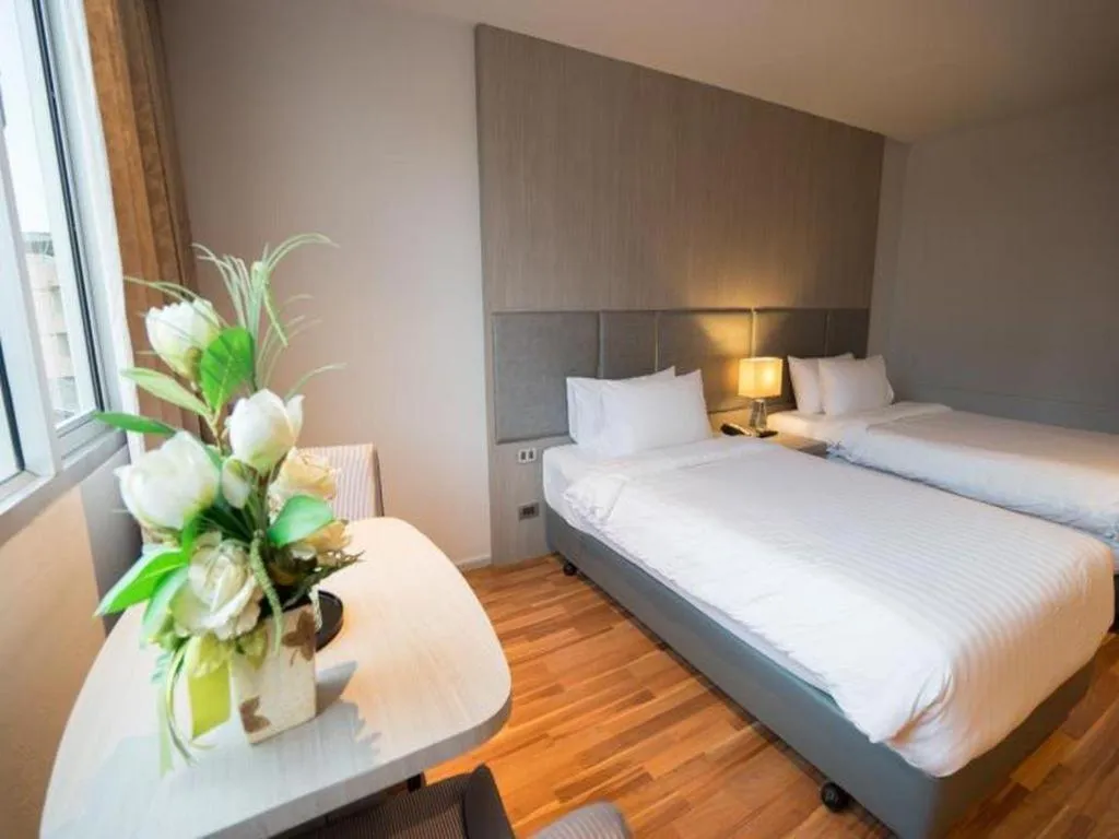 Bed in New Season Square Hotel