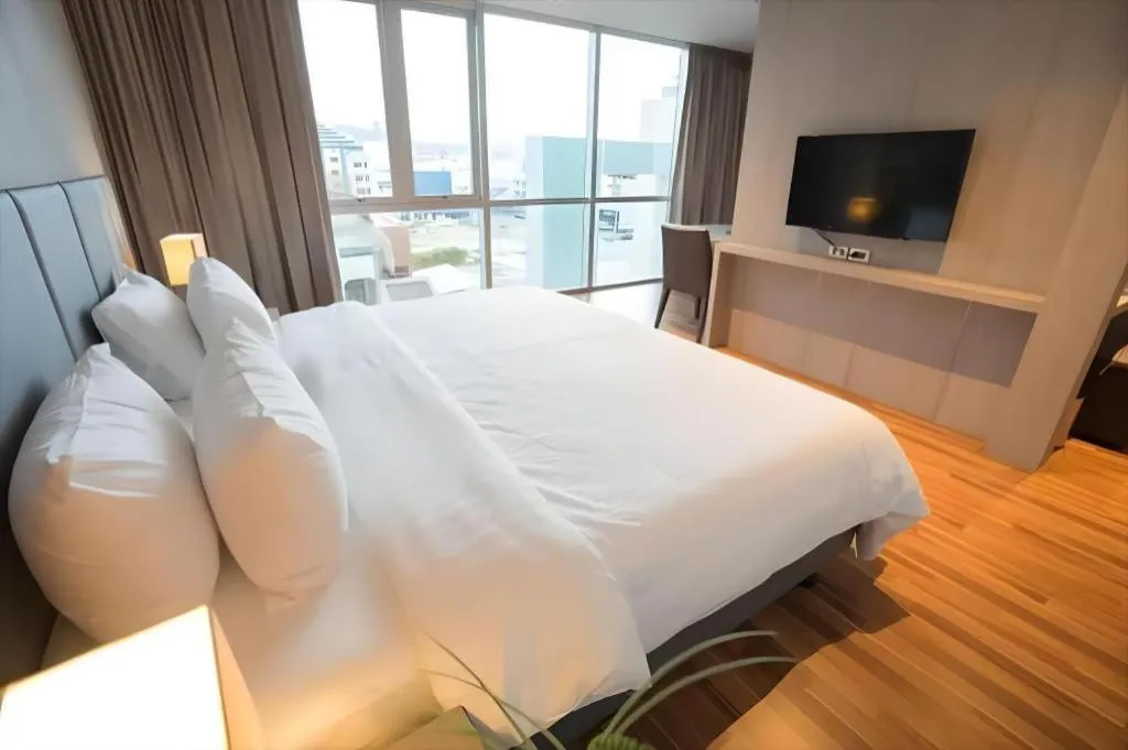 Bed in New Season Square Hotel