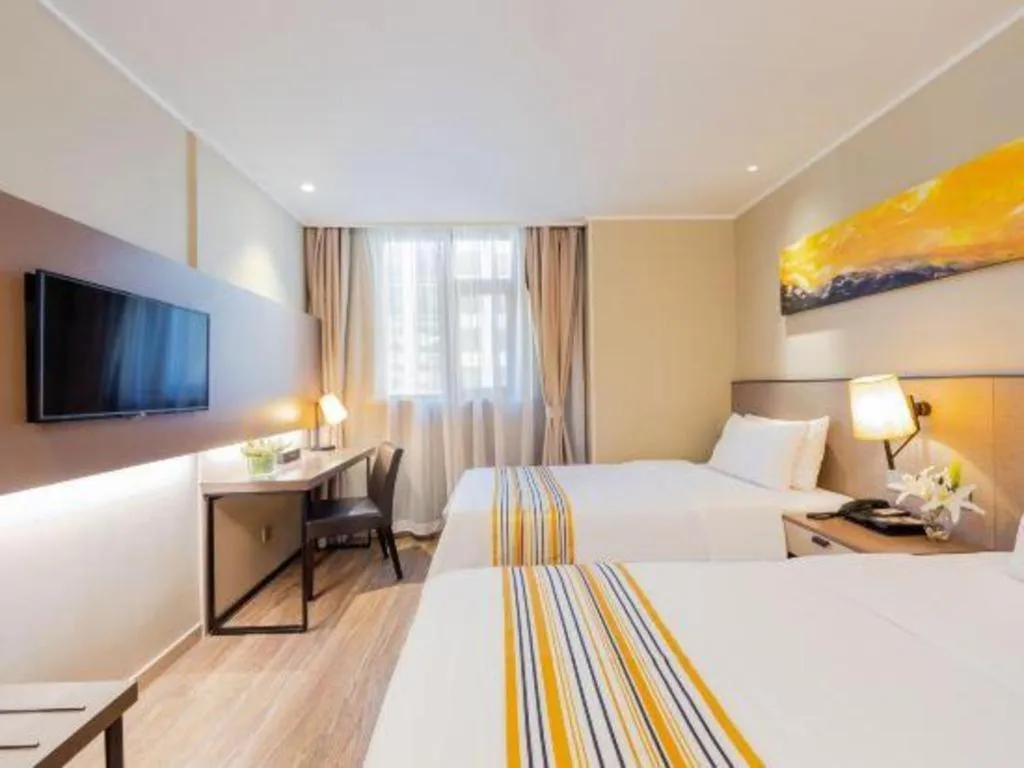 Bed in Home Inn Plus Shanghai Zhangjiang Guanglan Road Metro Station