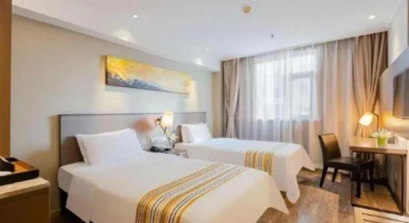 Bed in Home Inn Plus Shanghai Zhangjiang Guanglan Road Metro Station