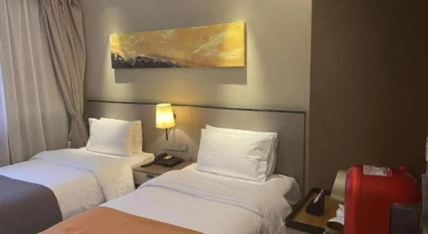 Bed in Home Inn Plus Shanghai Zhangjiang Guanglan Road Metro Station