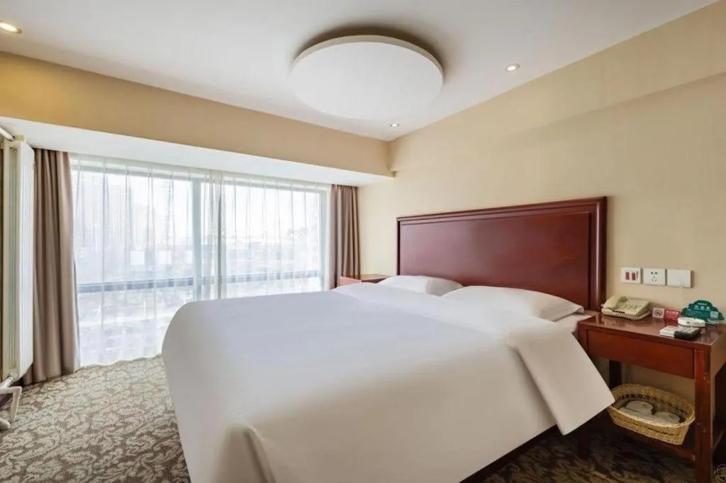 Bed in GreenTree Inn Tianjin JinNan ShuangLin Metro Station Express Hotel
