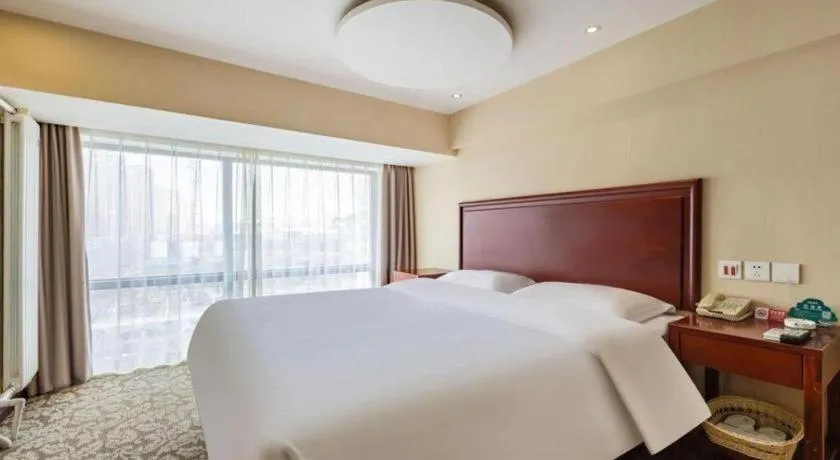 Bed in GreenTree Inn Tianjin JinNan ShuangLin Metro Station Express Hotel