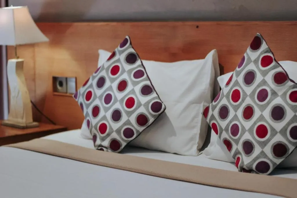 Bed in MANDARI HOTEL SINGARAJA