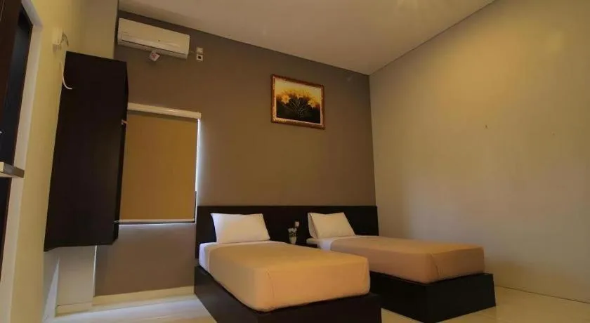 Bed in MANDARI HOTEL SINGARAJA