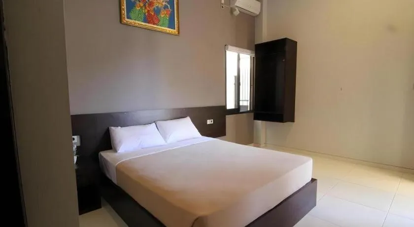Bed in MANDARI HOTEL SINGARAJA
