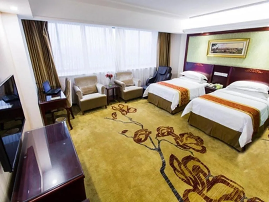 Bed in Vienna Hotel Yangzhou Outlets Plaza He Garden