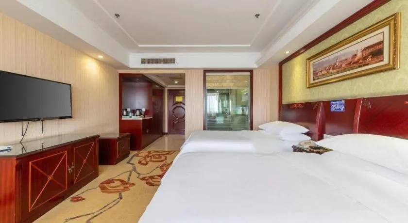 Bed in Vienna Hotel Yangzhou Outlets Plaza He Garden