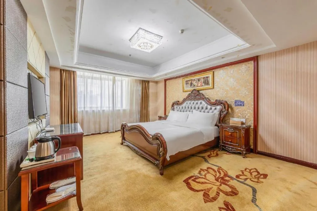 Bed in Vienna Hotel Yangzhou Outlets Plaza He Garden