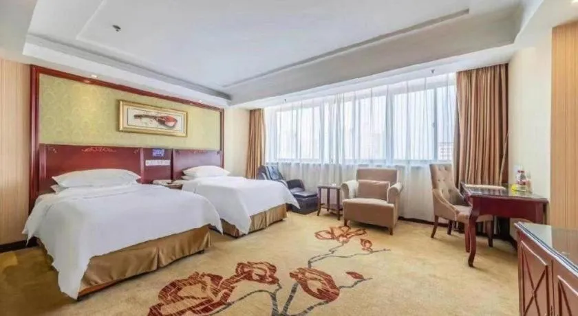 Bed in Vienna Hotel Yangzhou Outlets Plaza He Garden