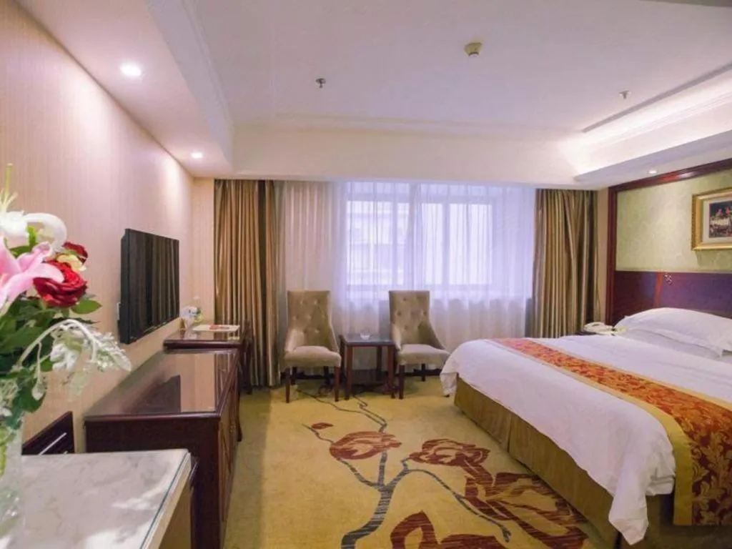 Bed in Vienna Hotel Yangzhou Outlets Plaza He Garden