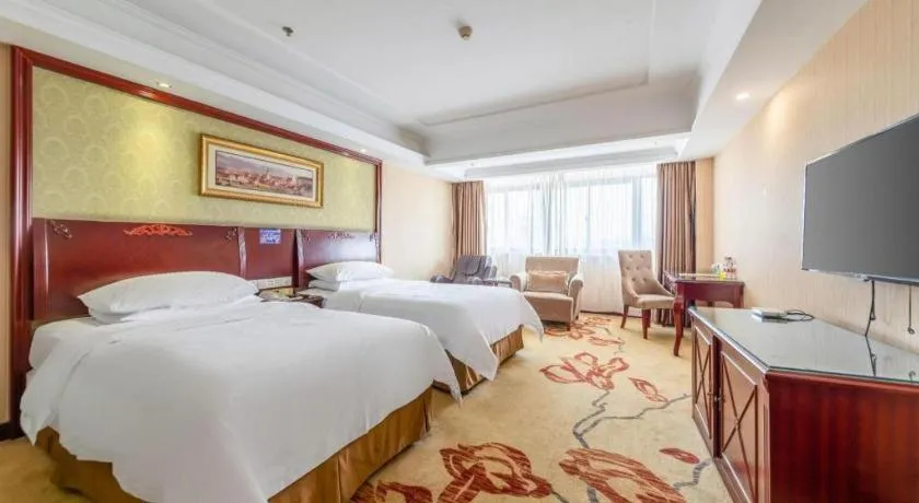 Bed in Vienna Hotel Yangzhou Outlets Plaza He Garden