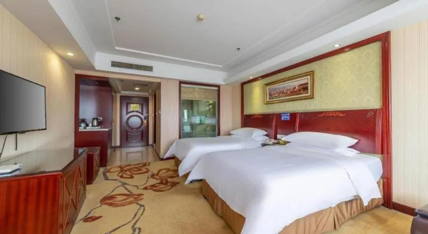 Bed in Vienna Hotel Yangzhou Outlets Plaza He Garden