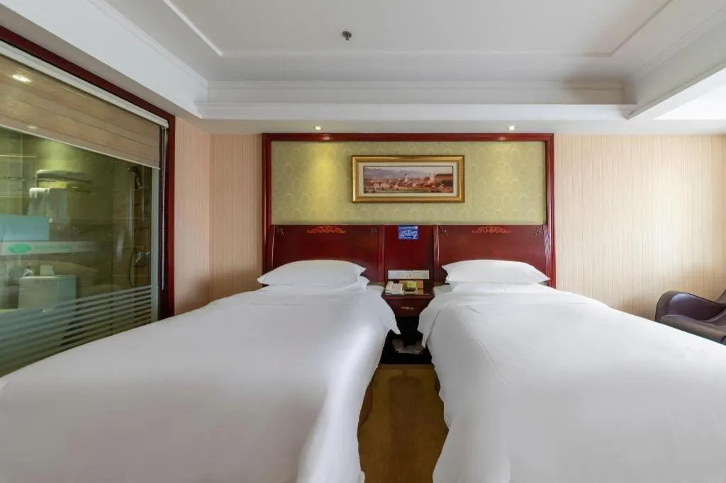 Bed in Vienna Hotel Yangzhou Outlets Plaza He Garden