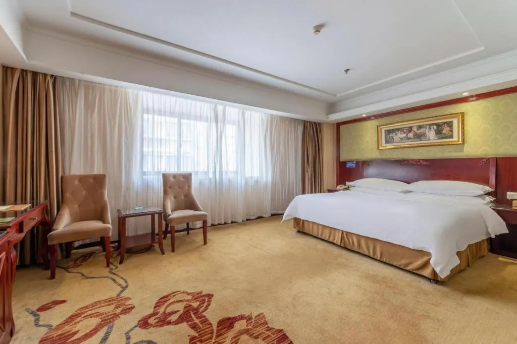 Bed in Vienna Hotel Yangzhou Outlets Plaza He Garden