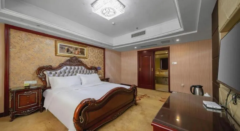 Bed in Vienna Hotel Yangzhou Outlets Plaza He Garden