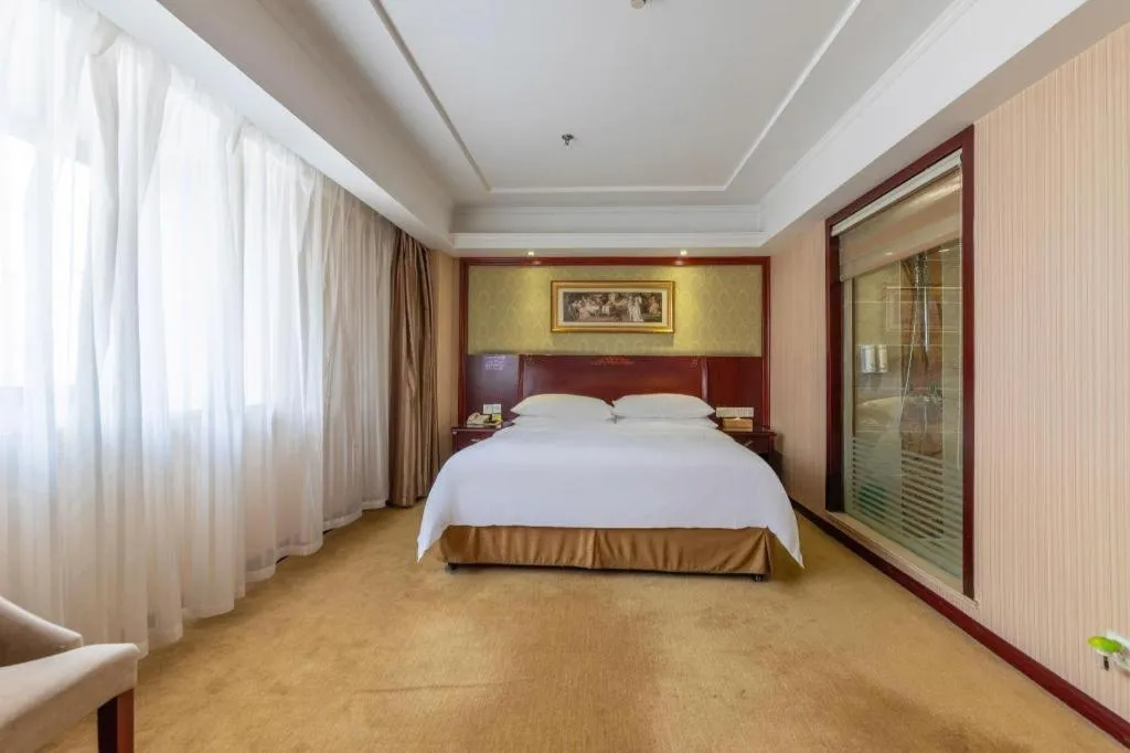 Bed in Vienna Hotel Yangzhou Outlets Plaza He Garden