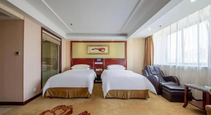 Bed in Vienna Hotel Yangzhou Outlets Plaza He Garden