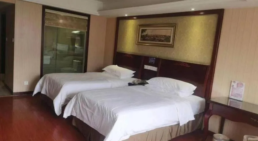 Bed in Vienna Hotel Yangzhou Outlets Plaza He Garden