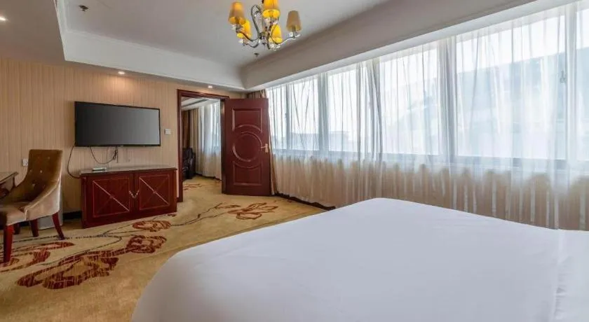 Bed in Vienna Hotel Yangzhou Outlets Plaza He Garden