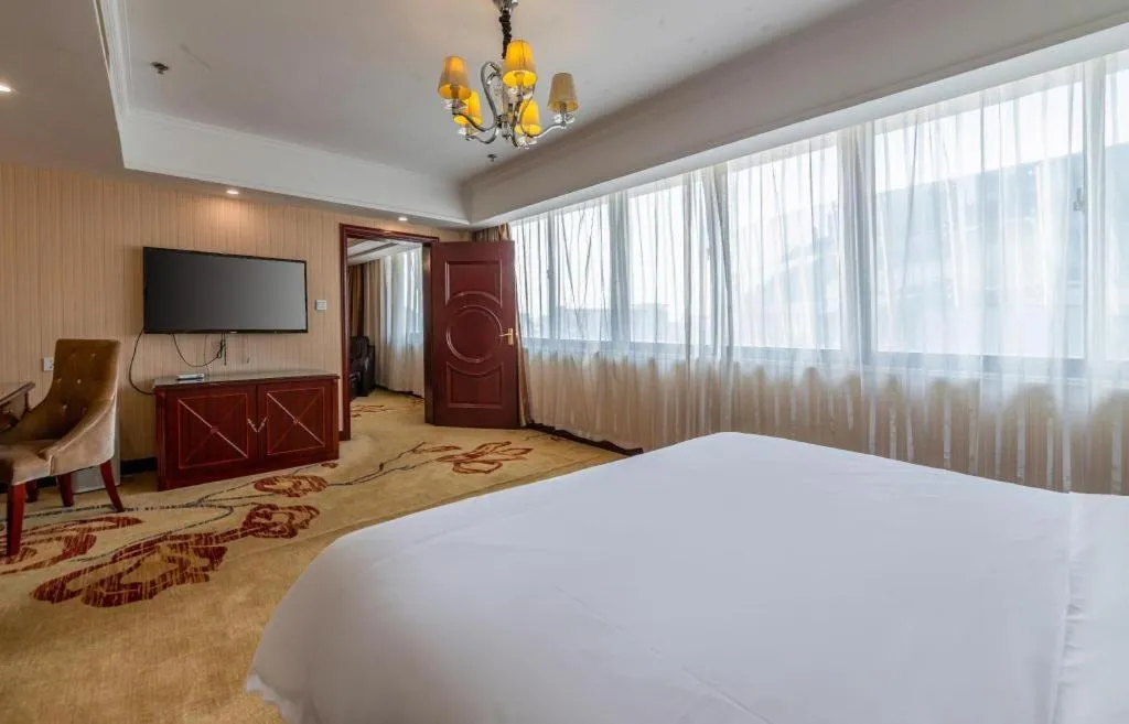 Bed in Vienna Hotel Yangzhou Outlets Plaza He Garden