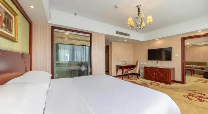 Bed in Vienna Hotel Yangzhou Outlets Plaza He Garden