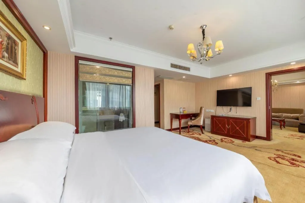 Bed in Vienna Hotel Yangzhou Outlets Plaza He Garden