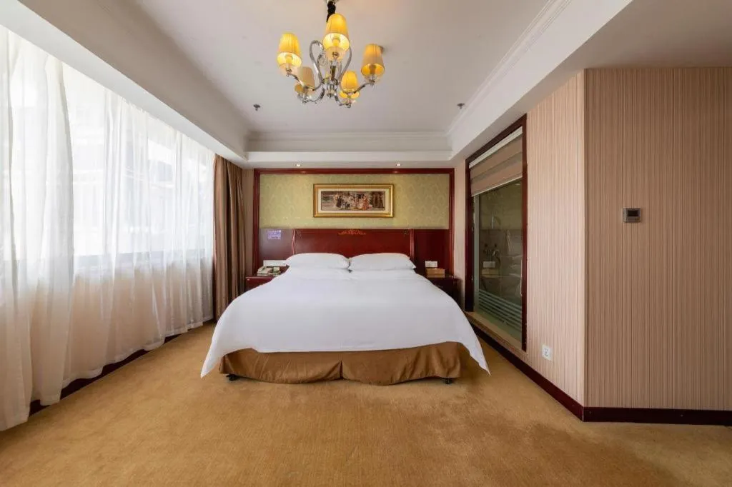 Bed in Vienna Hotel Yangzhou Outlets Plaza He Garden