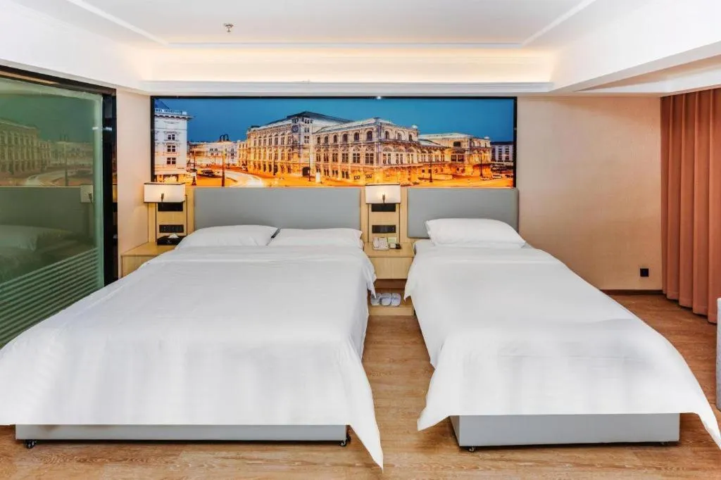 Bed in Vienna Hotel Yangzhou Outlets Plaza He Garden