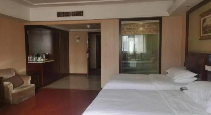 Bed in Vienna Hotel Yangzhou Outlets Plaza He Garden