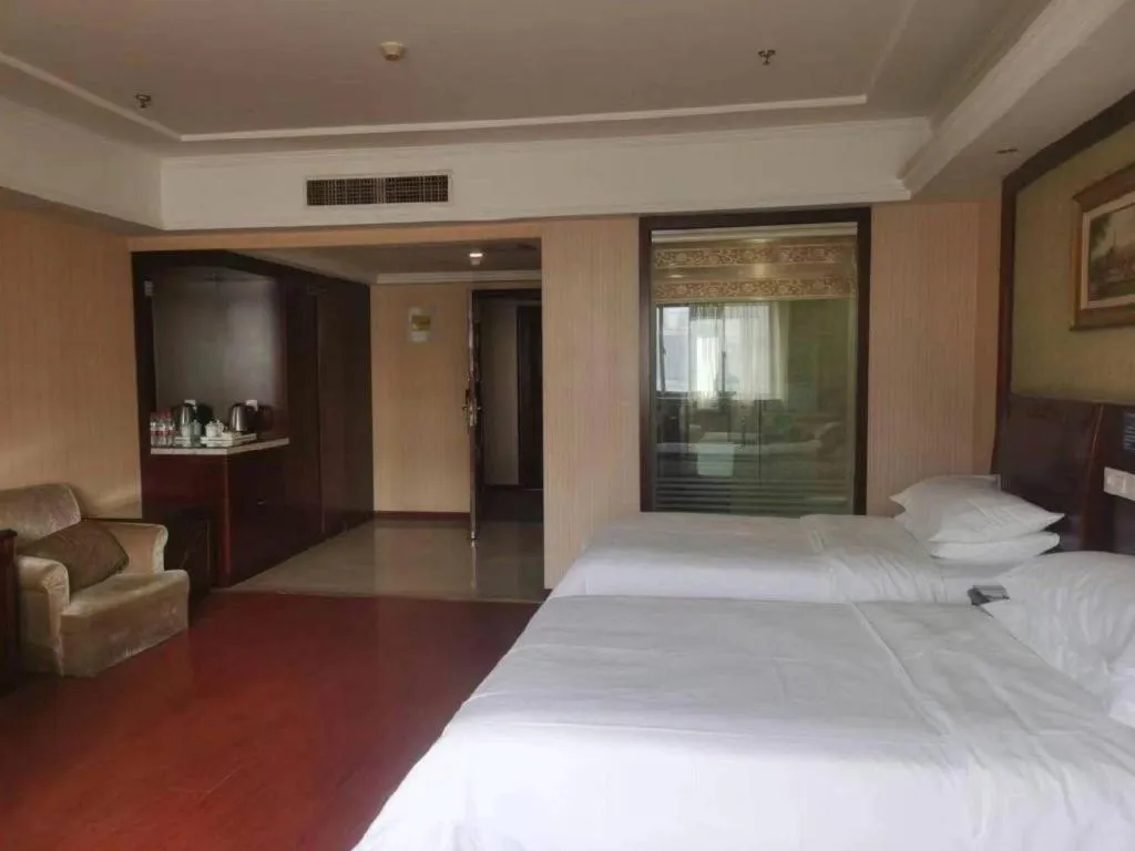 Bed in Vienna Hotel Yangzhou Outlets Plaza He Garden