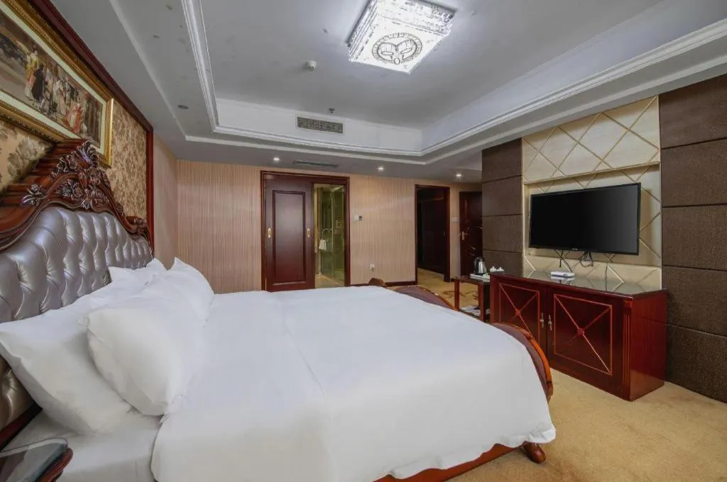 Bed in Vienna Hotel Yangzhou Outlets Plaza He Garden
