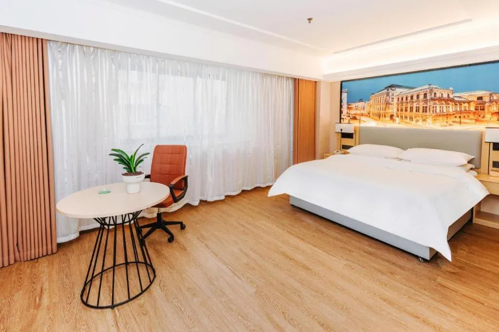 Bed in Vienna Hotel Yangzhou Outlets Plaza He Garden