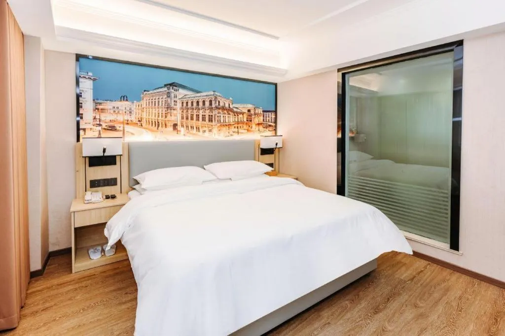 Bed in Vienna Hotel Yangzhou Outlets Plaza He Garden