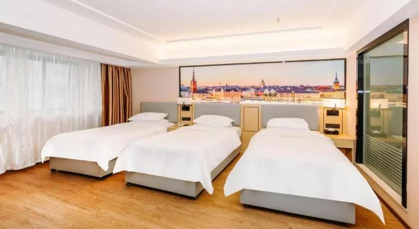 Bed in Vienna Hotel Yangzhou Outlets Plaza He Garden