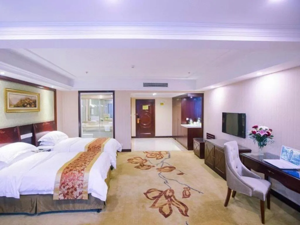 Bed in Vienna Hotel Yangzhou Outlets Plaza He Garden