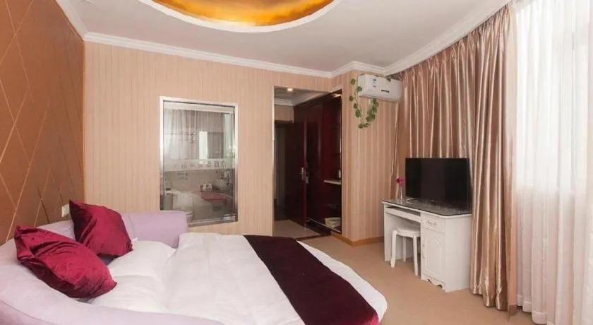 Bed in GreenTree Inn Wuxi Donggang Town Donghutang Shell Hotel