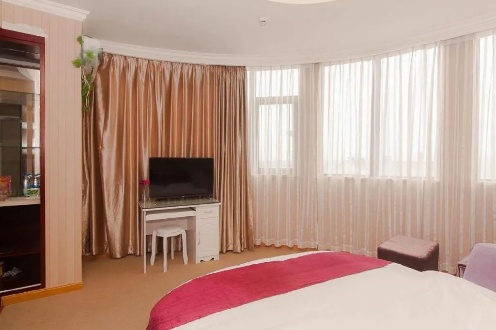 Bed in GreenTree Inn Wuxi Donggang Town Donghutang Shell Hotel