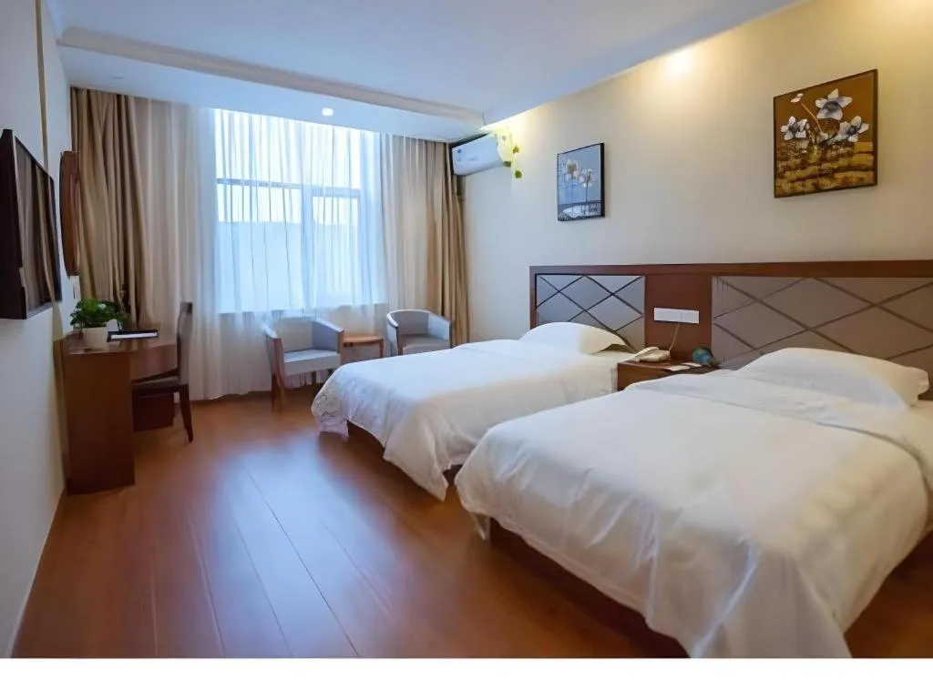 Bed in GreenTree Inn Wuxi Donggang Town Donghutang Shell Hotel