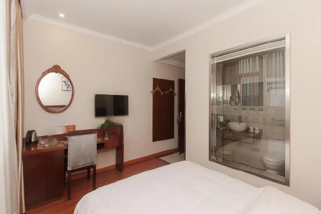 Bed in GreenTree Inn Wuxi Donggang Town Donghutang Shell Hotel