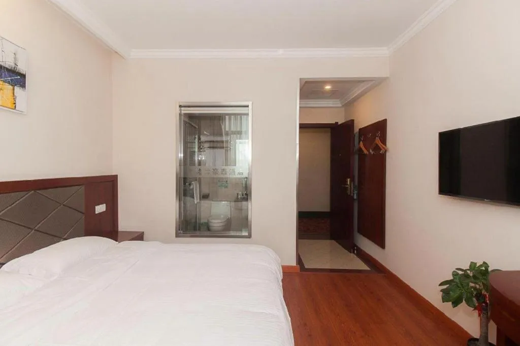 Bed in GreenTree Inn Wuxi Donggang Town Donghutang Shell Hotel