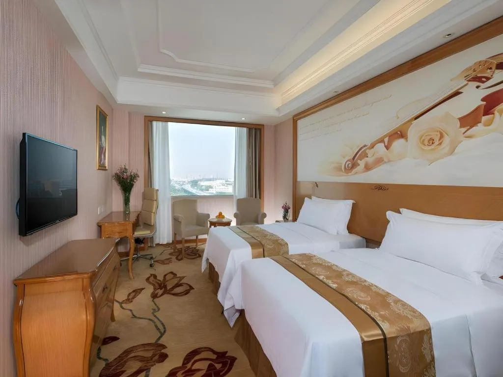 Bed in Vienna International Hotel Guangzhou Jichang Road Huangshi