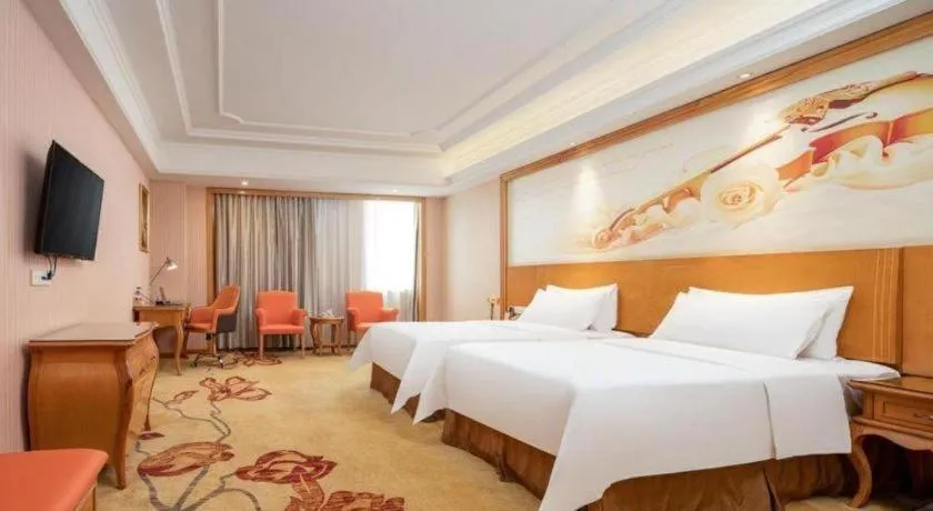 Bed in Vienna International Hotel Guangzhou Jichang Road Huangshi
