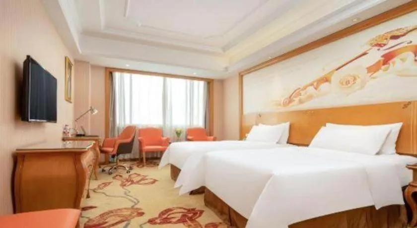 Bed in Vienna International Hotel Guangzhou Jichang Road Huangshi